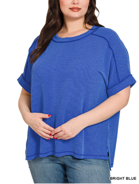 Bright blue ribbed cuff sleeve top with raw edges by Modern Grace, featuring a curved fit and raised texture.