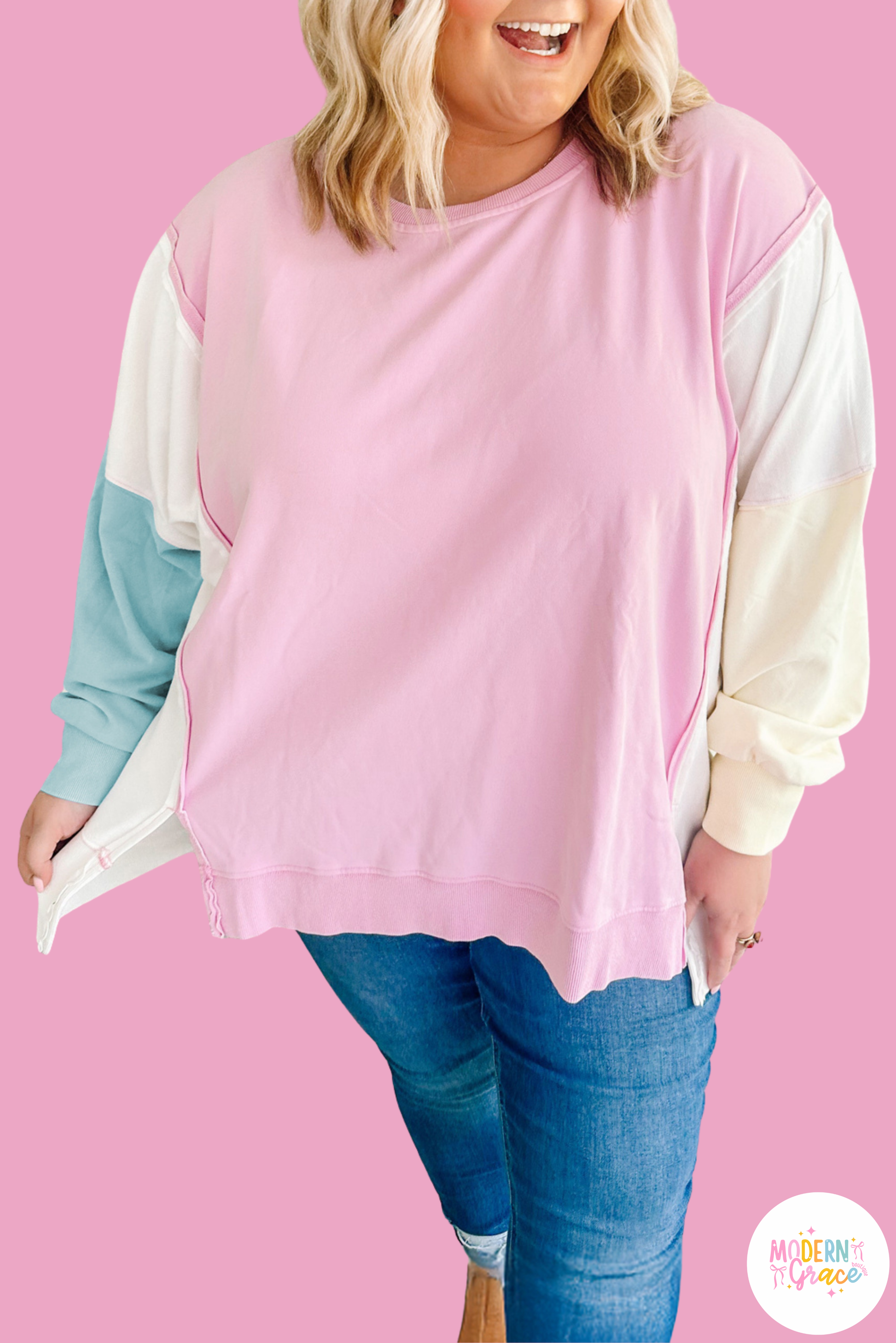 Plus size pink colorblock patchwork sweatshirt by Modern Grace with a relaxed fit, showcasing a stylish, casual hoodie design.