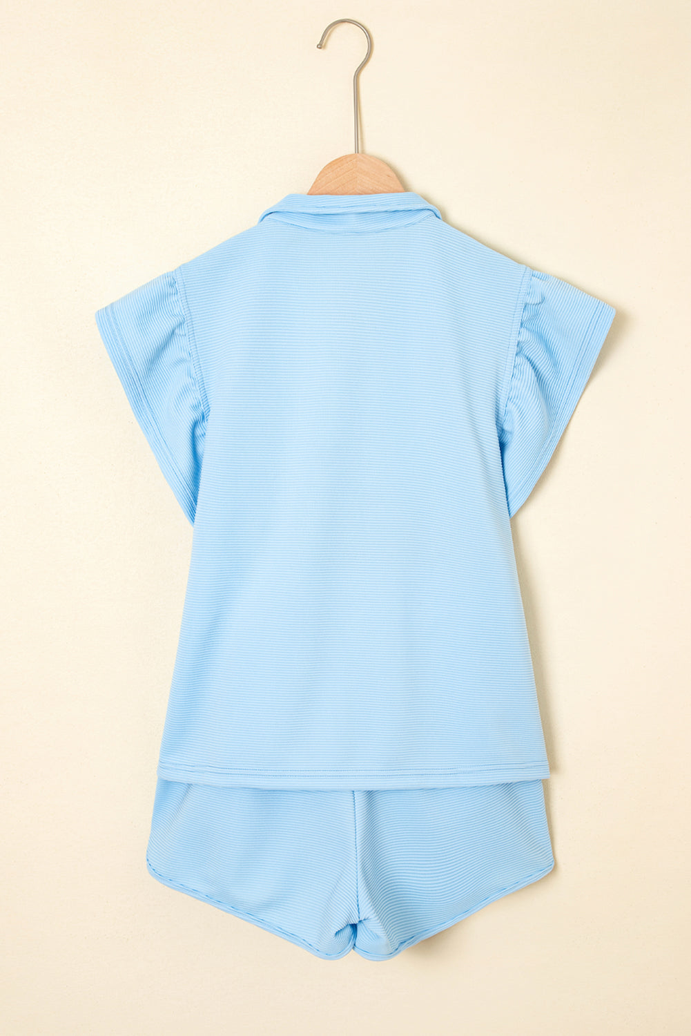 Modern Grace Beau Blue striped short set featuring flutter sleeves, zipped collar, and two-piece design for a stylish summer look.
