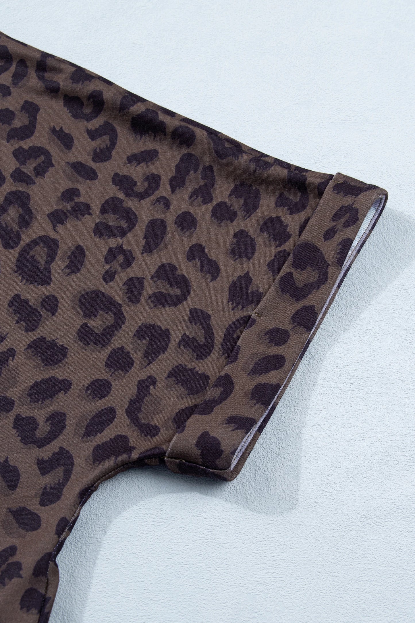 Brown leopard print V-neck high waist two-piece short set by Modern Grace, featuring a stylish top and matching shorts.