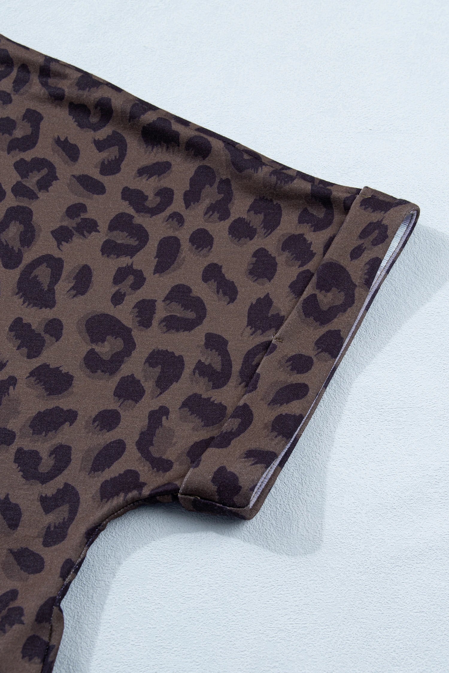 Brown leopard print V-neck high waist two-piece short set by Modern Grace, featuring a stylish top and matching shorts.