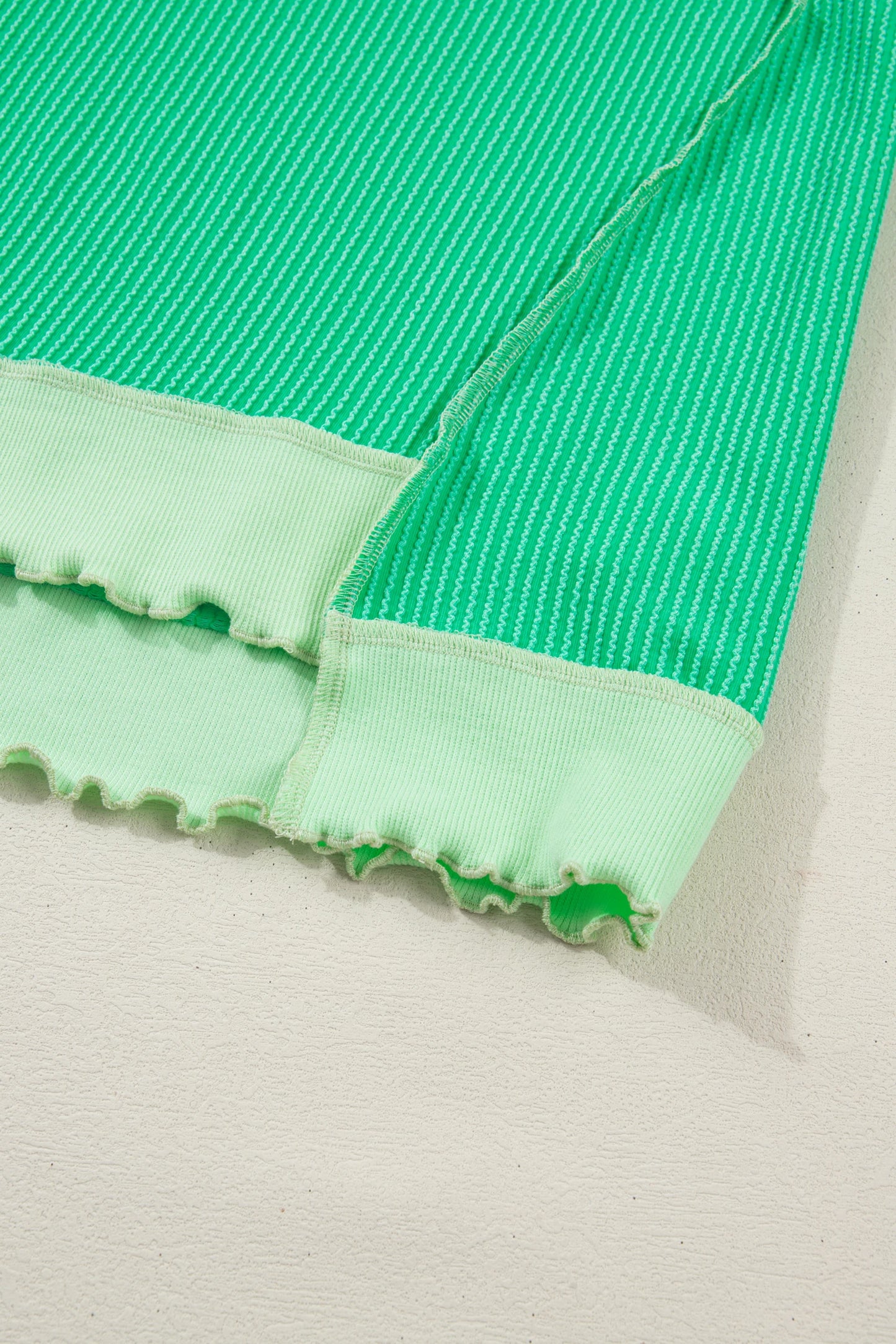 Mint green twisted rib knit tee with drop shoulder and uneven hem, stylish top by Modern Grace.