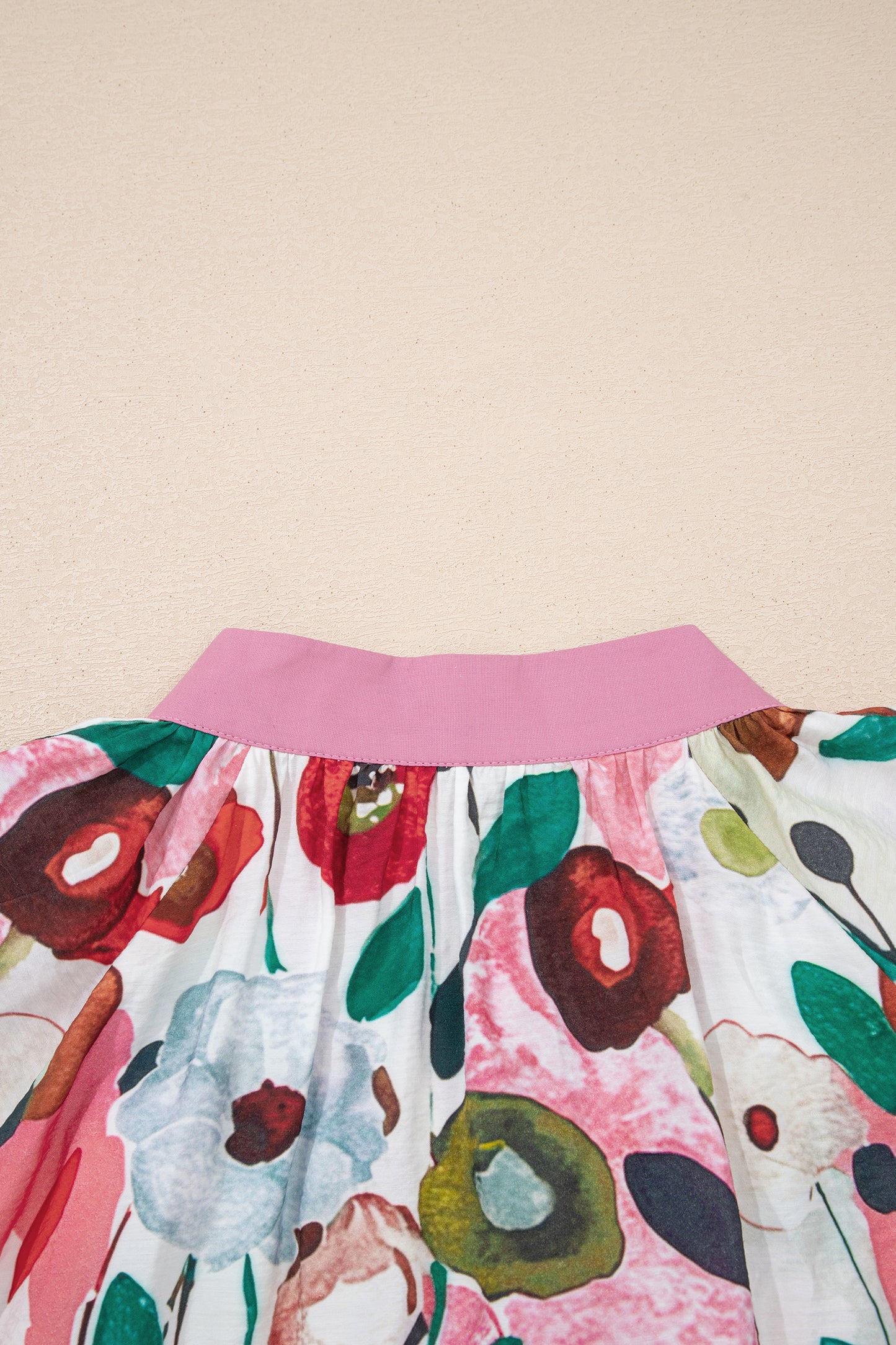 Pink V-neck plus size floral blouse with short puff sleeves by Modern Grace, featuring a stylish and comfortable fit.