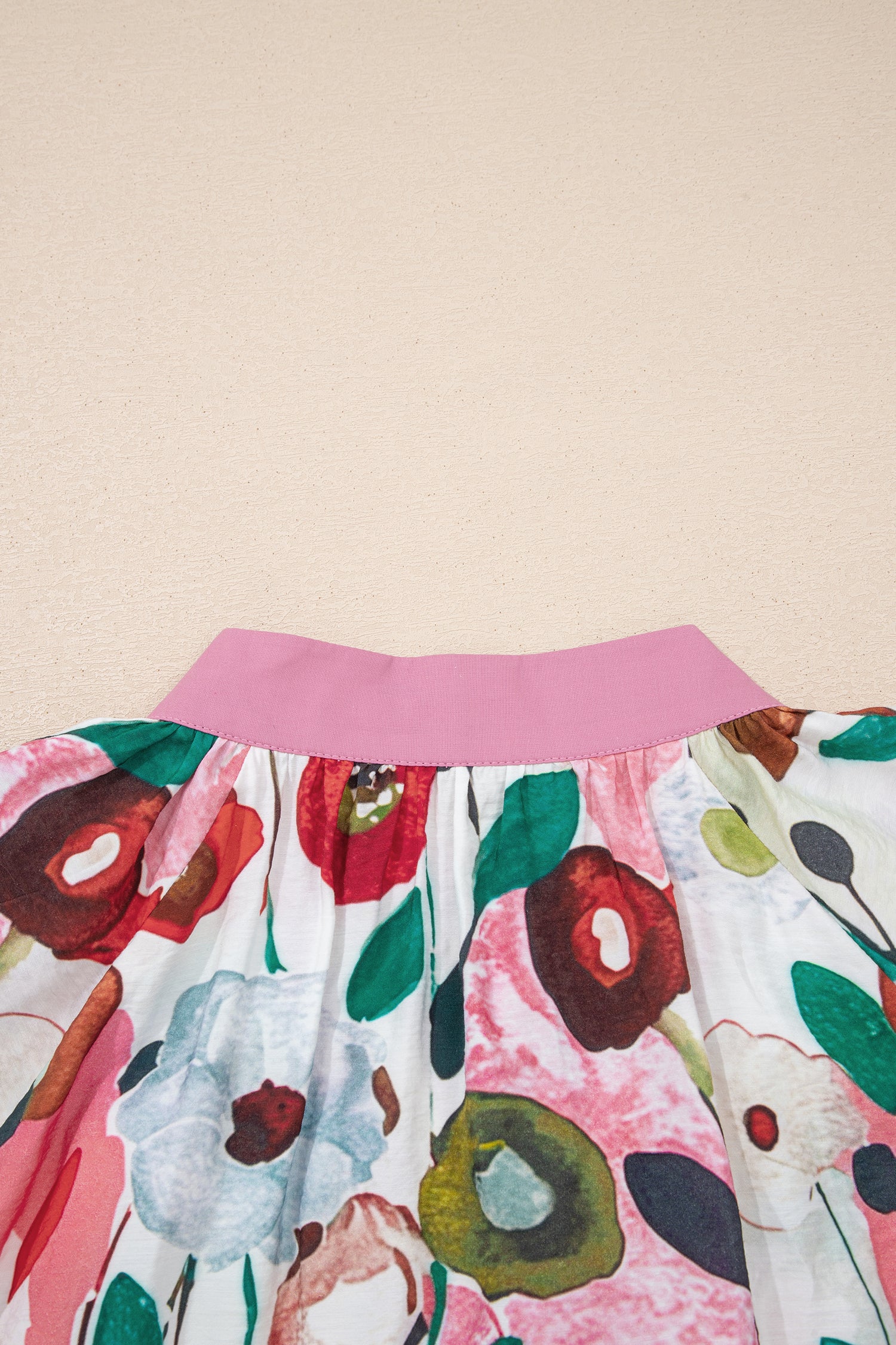 Pink V-neck plus size floral blouse with short puff sleeves by Modern Grace, featuring a stylish and comfortable fit.