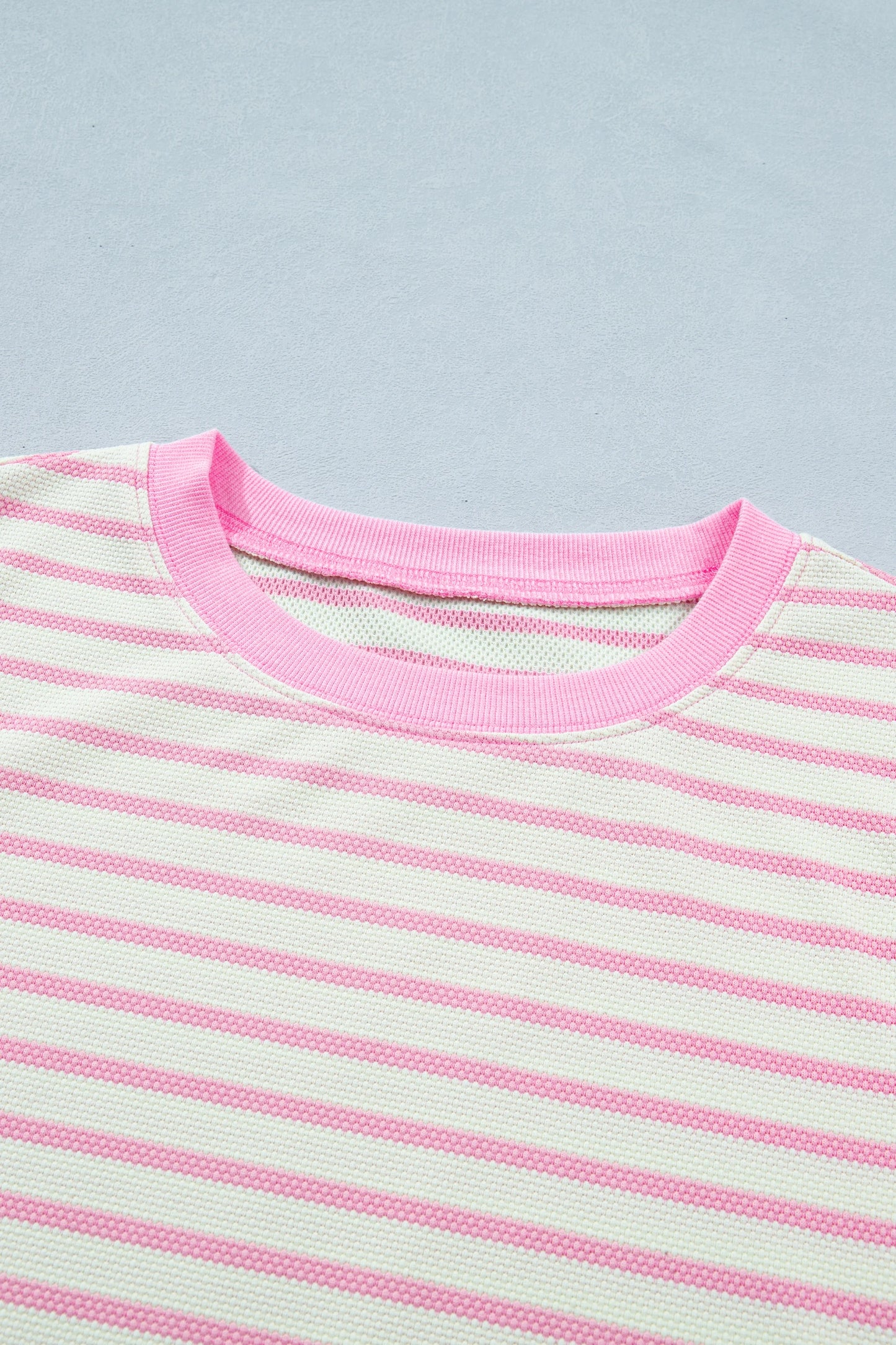 Pink stripe colorblock ruffle short sleeve blouse by Modern Grace featuring patchwork design and feminine ruffle details.
