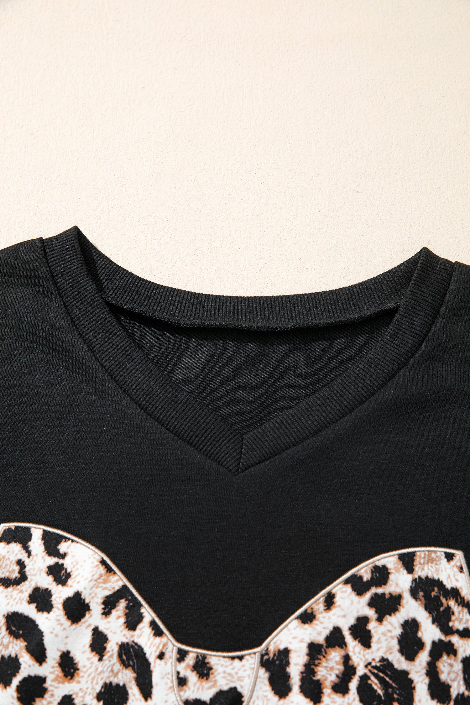 Black leopard print V-neck loose tee and drawstring shorts set by Modern Grace, stylish two-piece casual outfit.