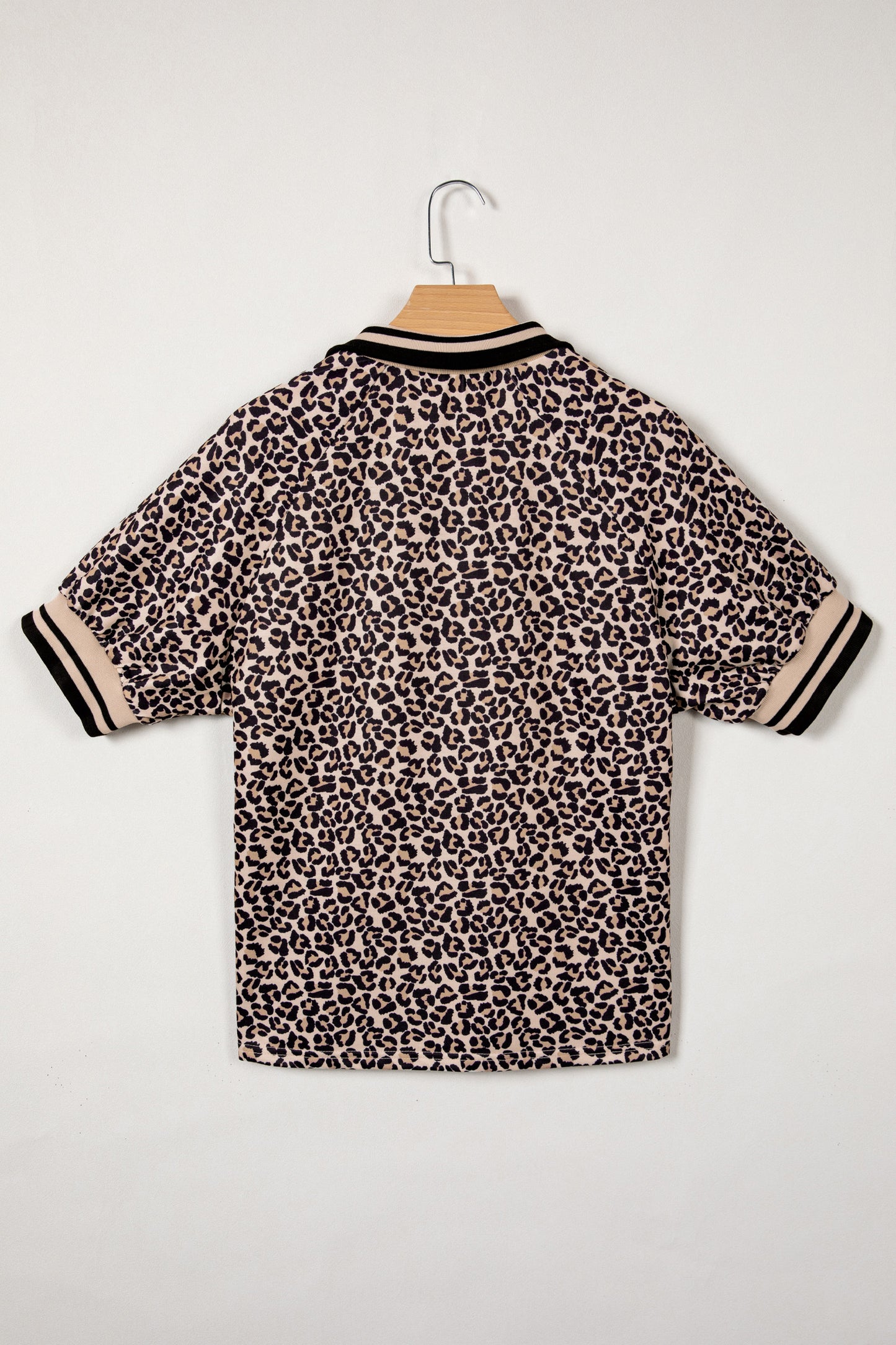 Modern Grace brown leopard print half zip top with striped trim and patchwork short sleeves, stylish blouse for casual wear.