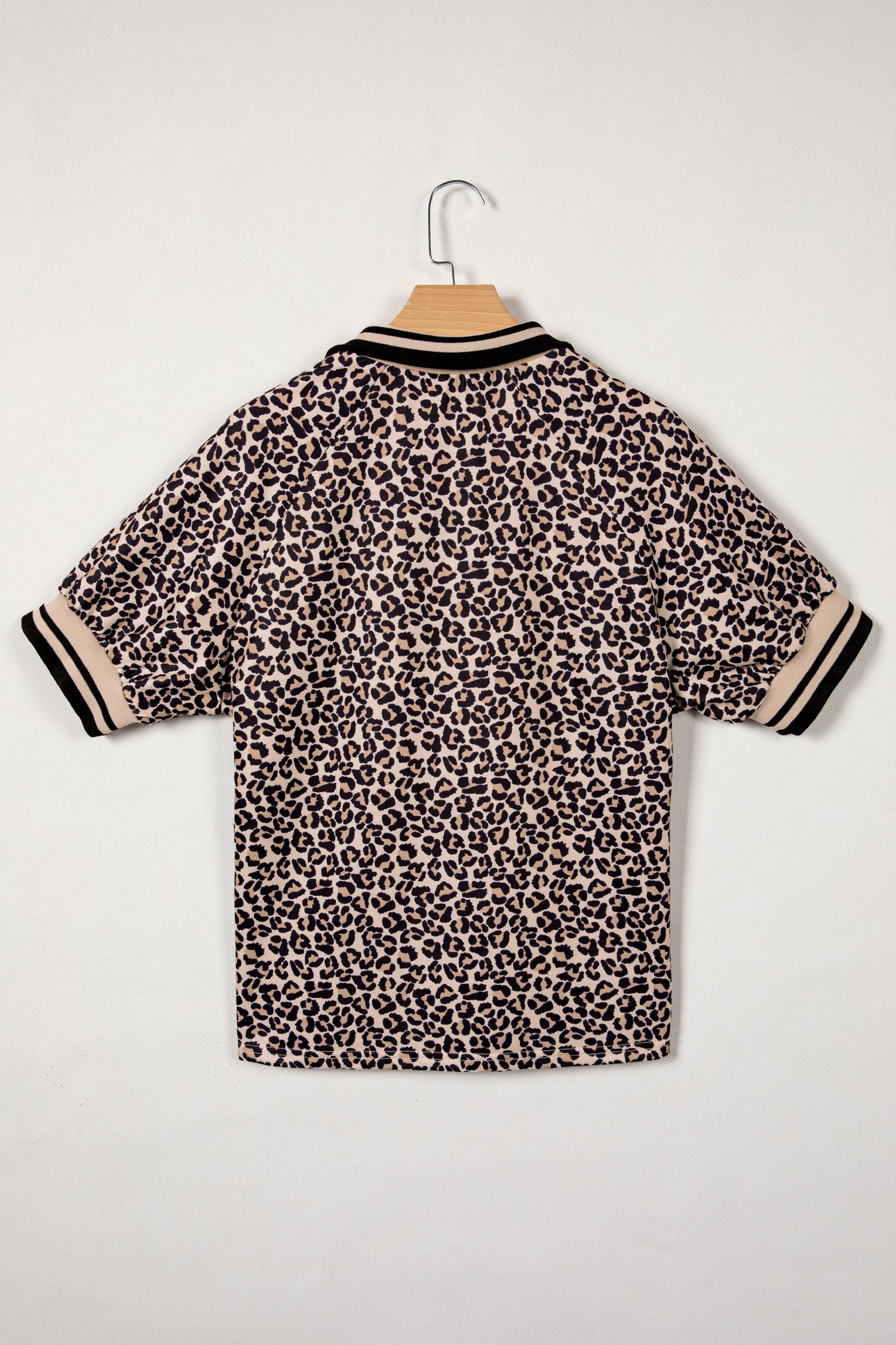 Modern Grace brown leopard print half zip top with striped trim and patchwork short sleeves, stylish blouse for casual wear.