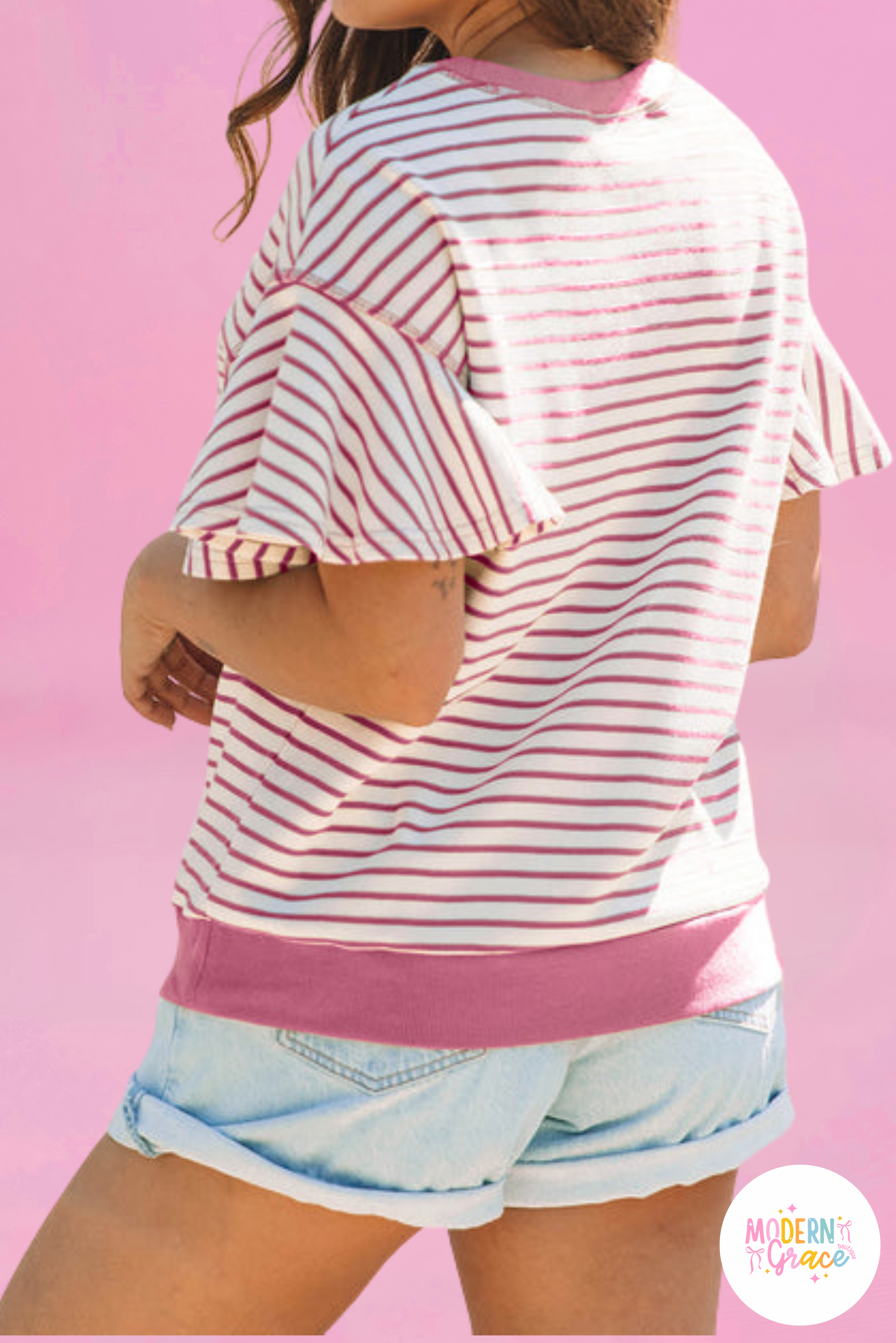 Pink striped ruffle short sleeve top with contrast detail from Modern Grace, stylish and lightweight for casual wear.