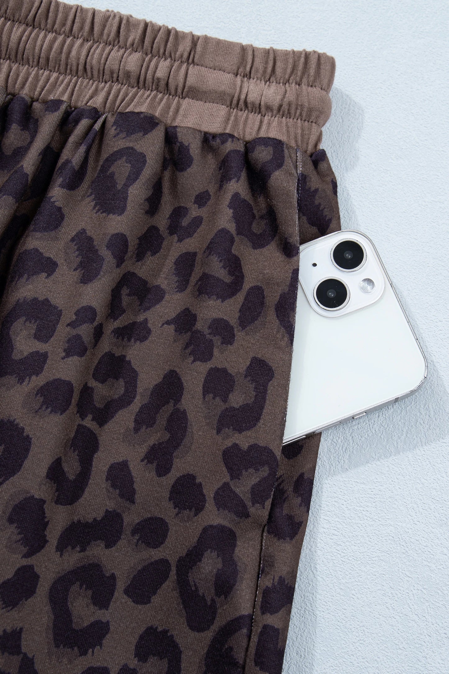 Brown leopard print V-neck high waist two-piece short set by Modern Grace, featuring a stylish crop top and matching shorts.