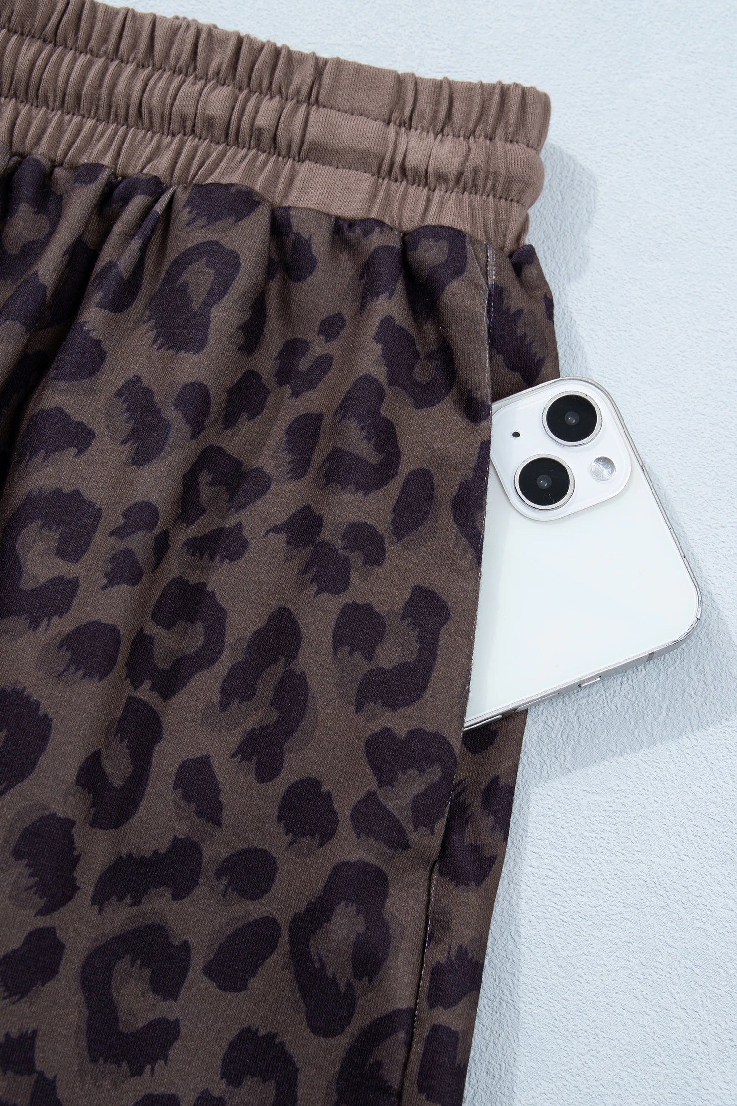 Brown leopard print V-neck high waist two-piece short set by Modern Grace, featuring a stylish crop top and matching shorts.