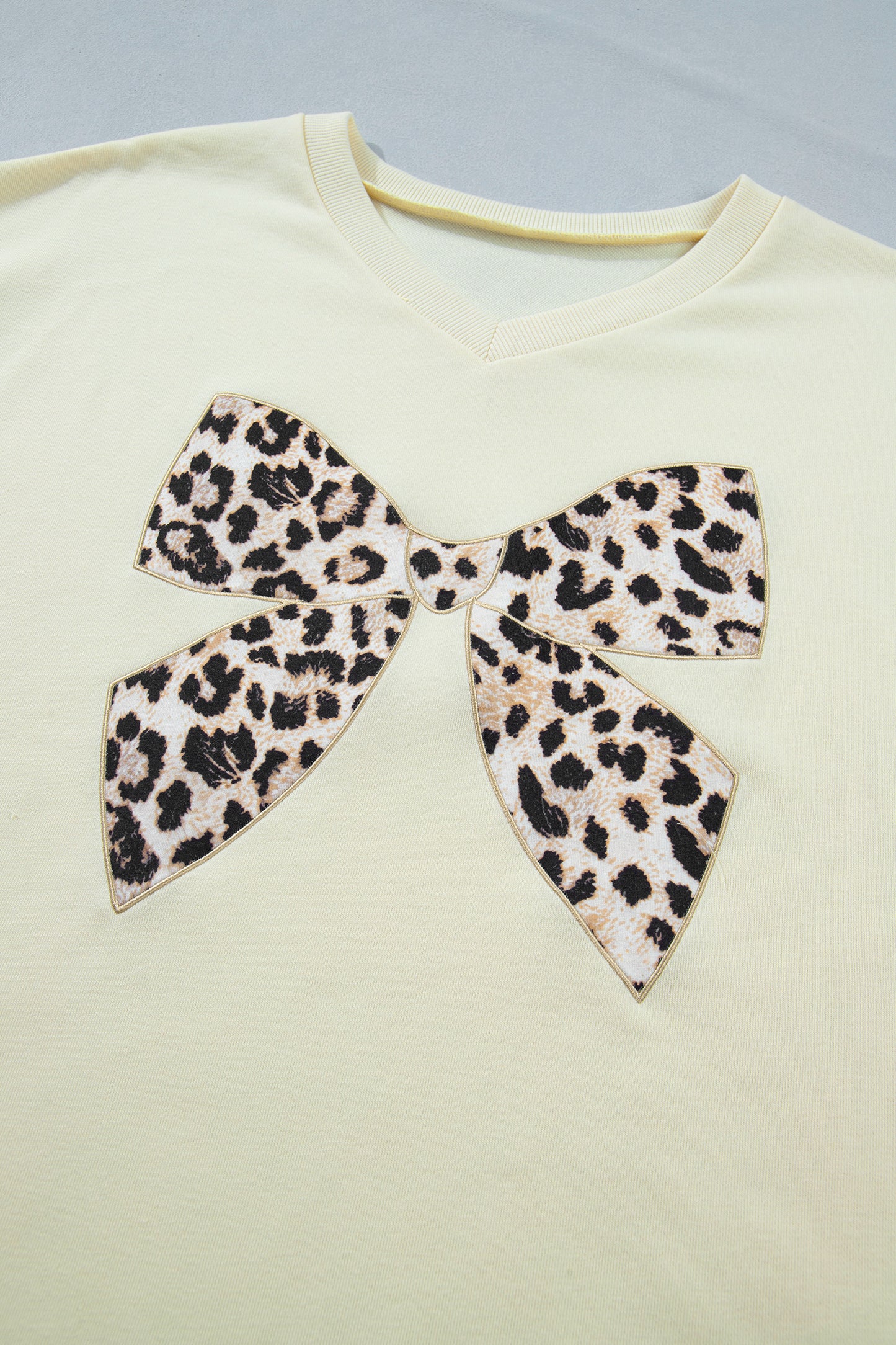 White contrast leopard bow patched V-neck loose tee and drawstring shorts two-piece set by Modern Grace, casual summer outfit.