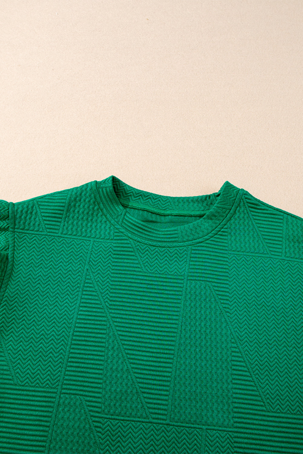 Dark green textured ruffle split top and drawstring shorts from Modern Grace, stylish two-piece set with ruffled details and comfortable fit.