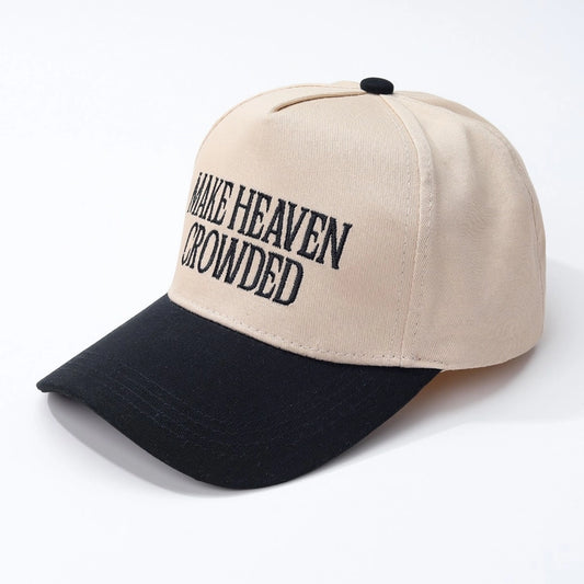 Black and tan Make Heaven Crowded baseball cap by Modern Grace, featuring a curved brim and adjustable strap in a casual hat style.