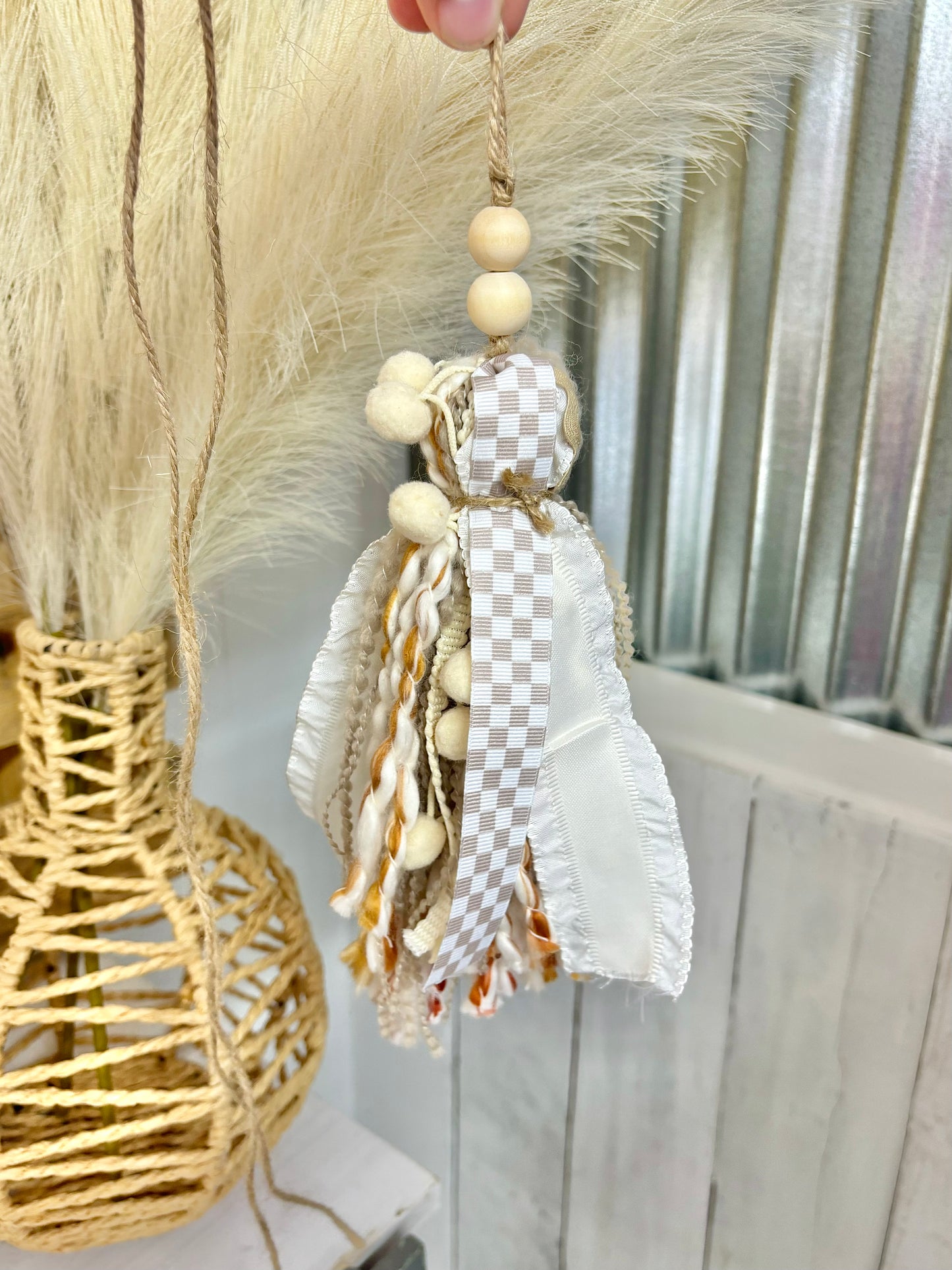 Tan checkered handmade Bible tassel by Harper Grace Design, versatile as a car charm or Bogg bag tassel accessory.