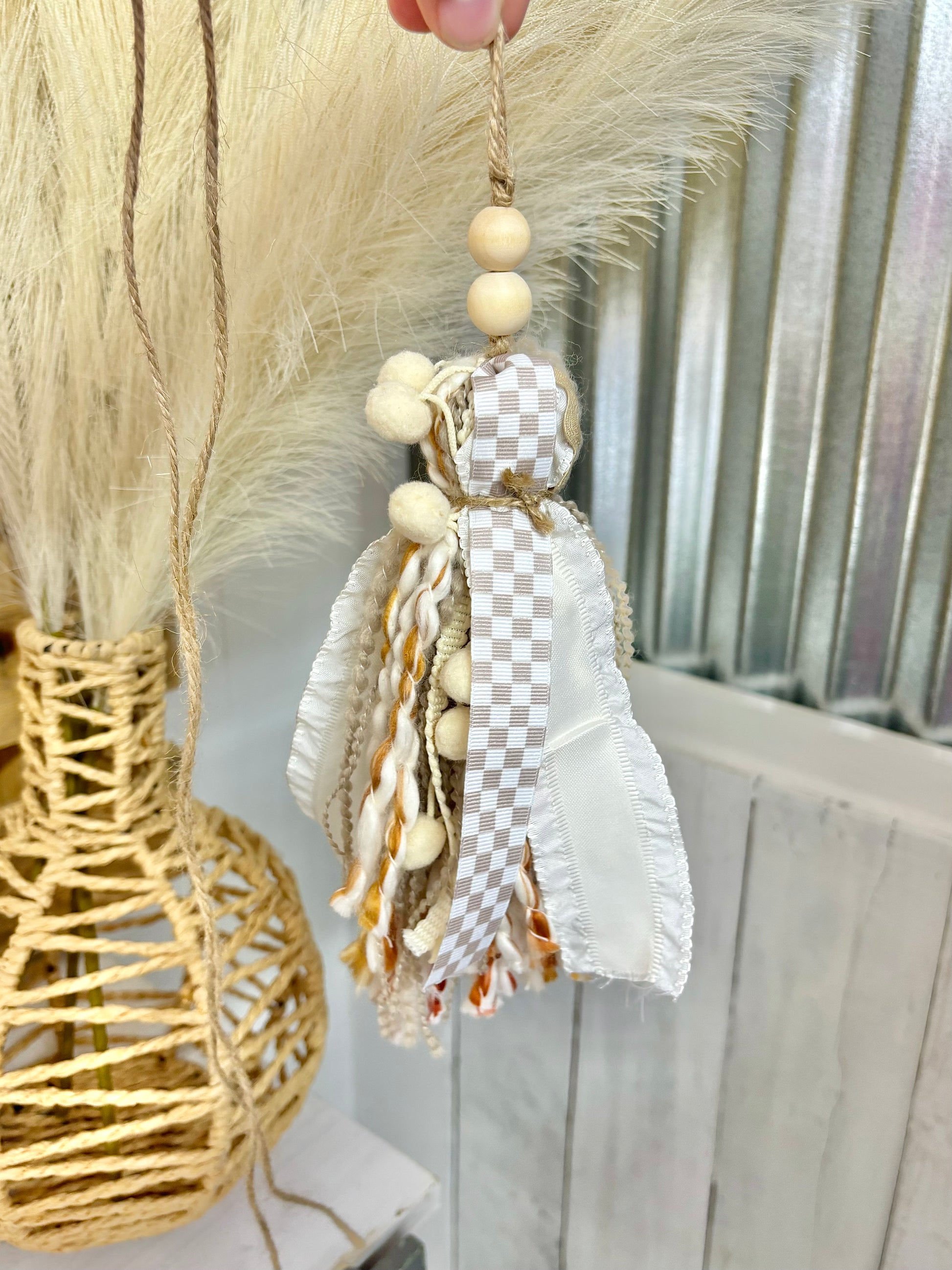 Tan checkered handmade Bible tassel by Harper Grace Design, versatile as a car charm or Bogg bag tassel accessory.