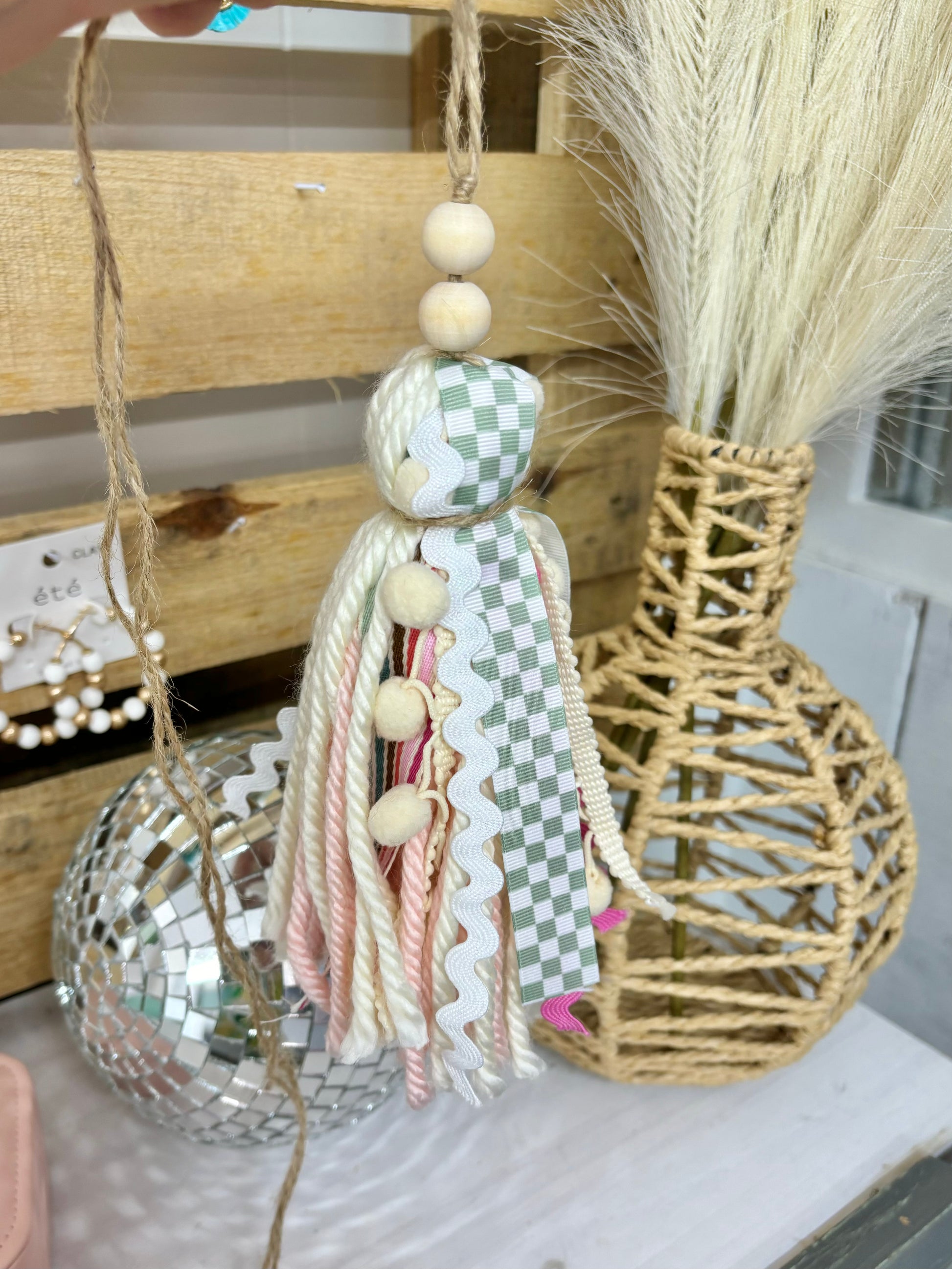 Tan checkered handmade Bible tassel by Harper Grace Design, versatile as a car charm or bag accessory, with decorative tassel details.