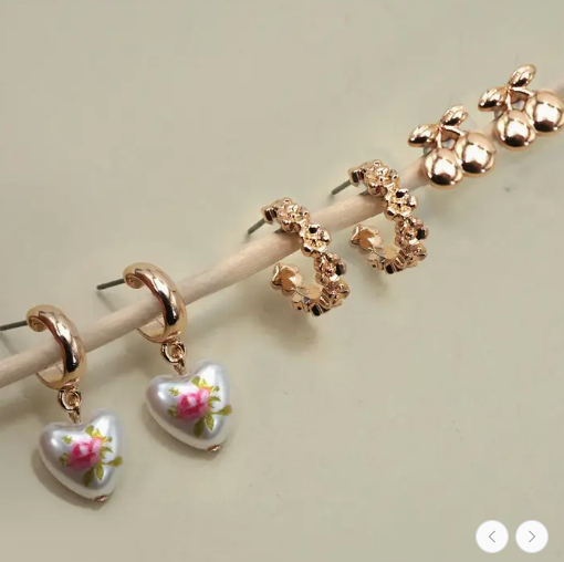 JOSSLYN by Wall to Wall cherry floral hoop heart huggie earrings set with three small earrings featuring floral and heart designs