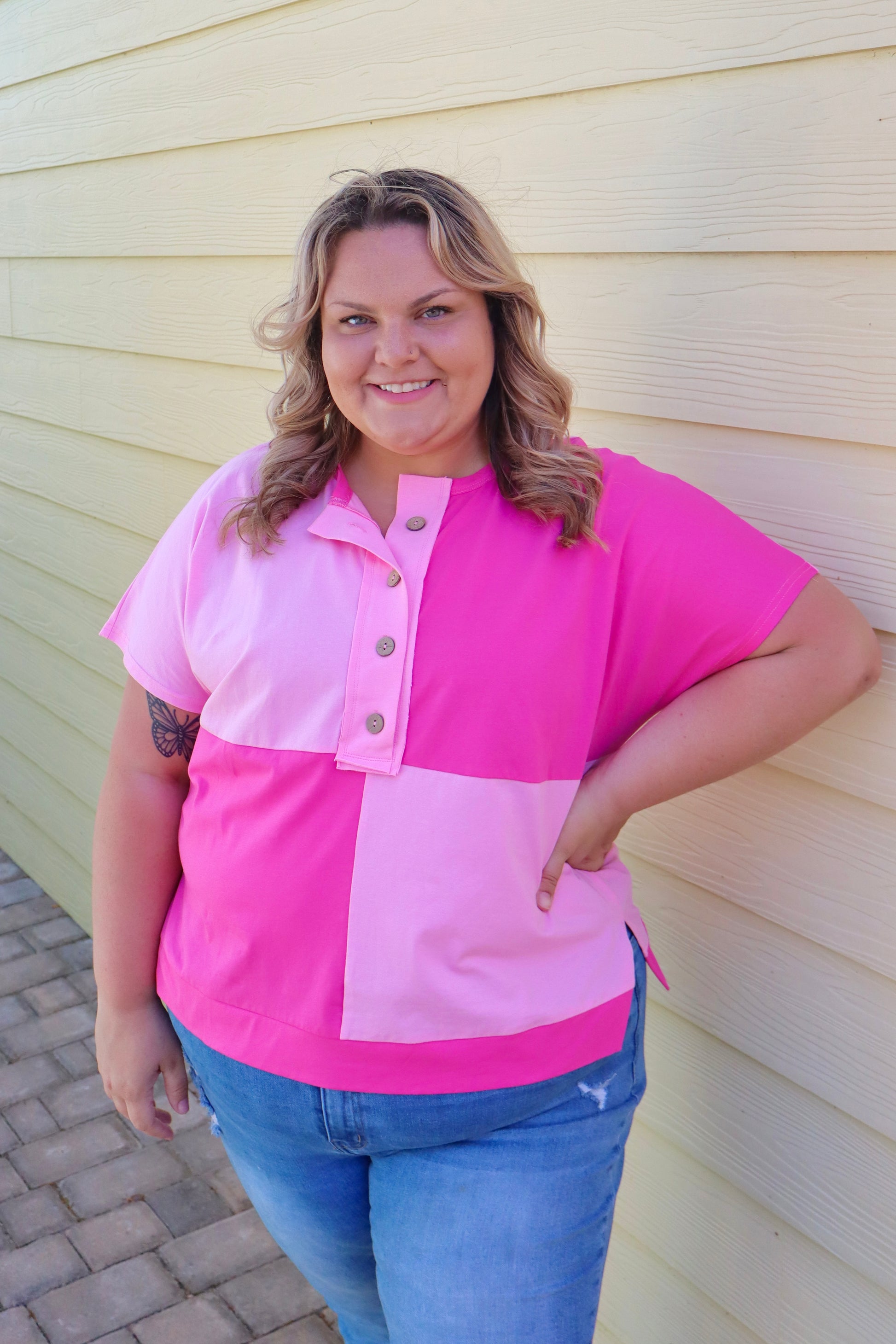 Bright pink colorblock patchwork henley top with short sleeves and button details by Modern Grace.