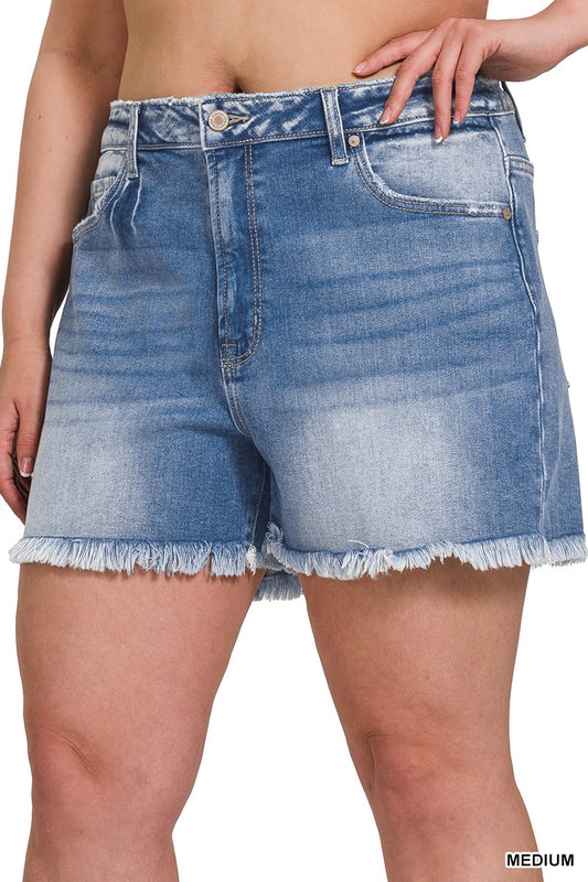 Modern Grace curvy mid-rise denim shorts with raw frayed hem, shown on a model, highlighting casual summer style.