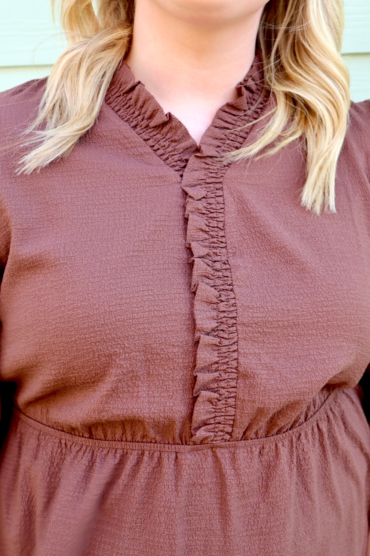 Curvy brown textured dress by Modern Grace with frilled trim, V-neck, and puff sleeves, showcasing a stylish and feminine silhouette.