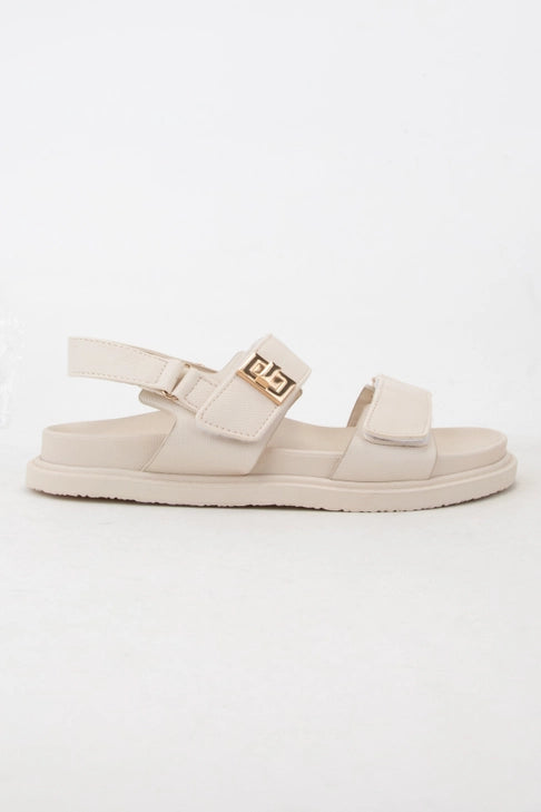 Bone color double Velcro strap sandal by Modern Grace, featuring a comfortable open-toe design and adjustable straps.