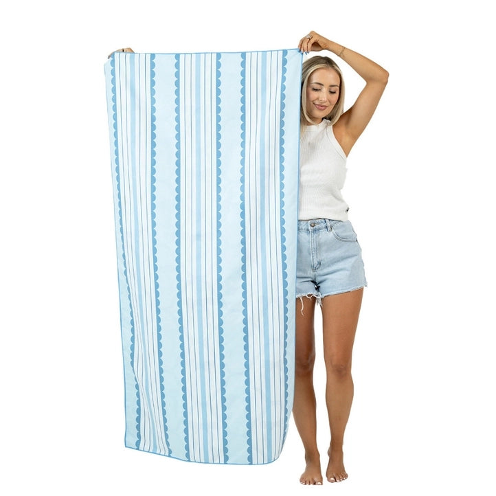 Blue Bow reversible microfiber beach towel by Modern Grace with a vibrant bow design, perfect for beach accessories.