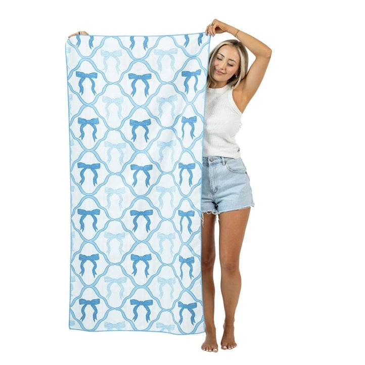 Blue bow reversible microfiber beach towel from Modern Grace with a stylish bow design, ideal for beach accessories.