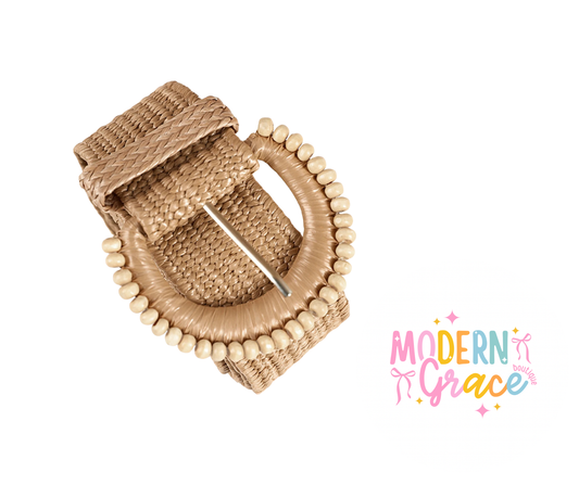 Modern Grace boho belt with woven design and tassel accents, shown on a neutral background.