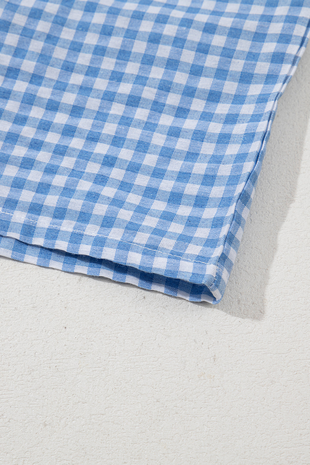 Blue gingham boxer shorts by Modern Grace, casual bottoms with a relaxed fit, made from lightweight polyester fabric.