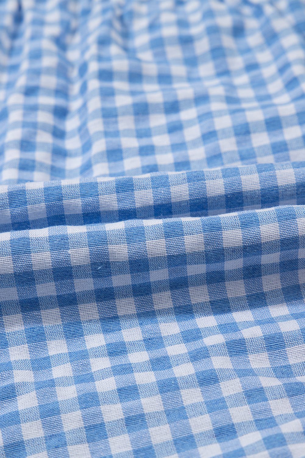 Blue gingham boxer shorts by Modern Grace, casual bottoms, lightweight polyester fabric, designed for comfort.