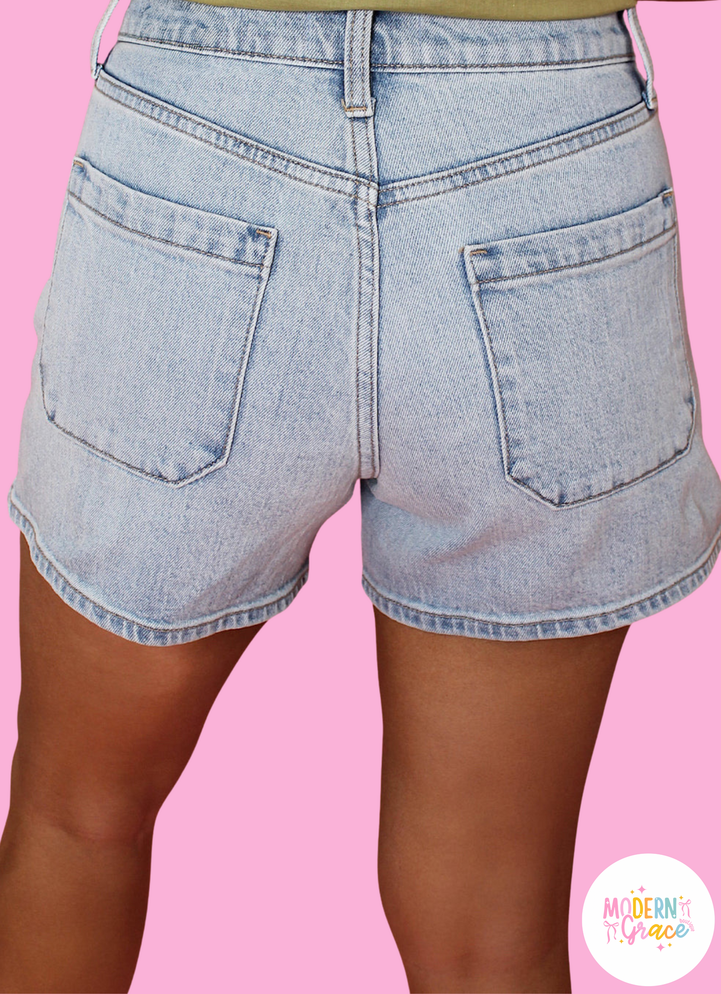 Modern Grace Beau Blue Light Wash High Rise Denim Shorts, bottom view showing relaxed fit, cotton blend fabric, and high waist design.