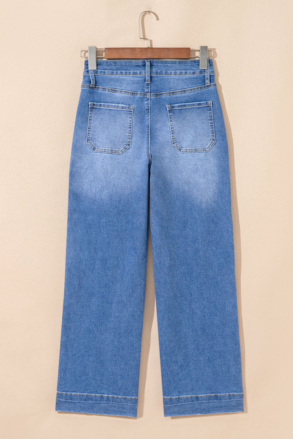 Modern Grace sky blue cropped high-rise wide-leg jeans, made of cotton and elastane, displayed on a hanger.