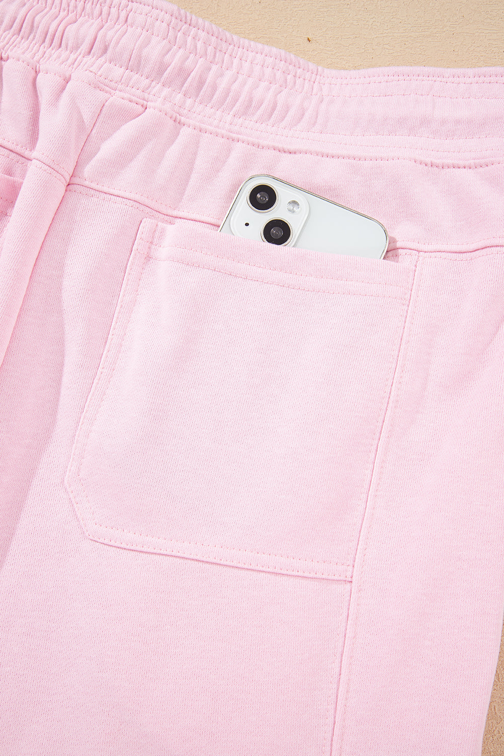 Light pink drawstring waist patchwork jogger pants by Modern Grace, casual solid color bottoms with comfortable fit and stylish design.