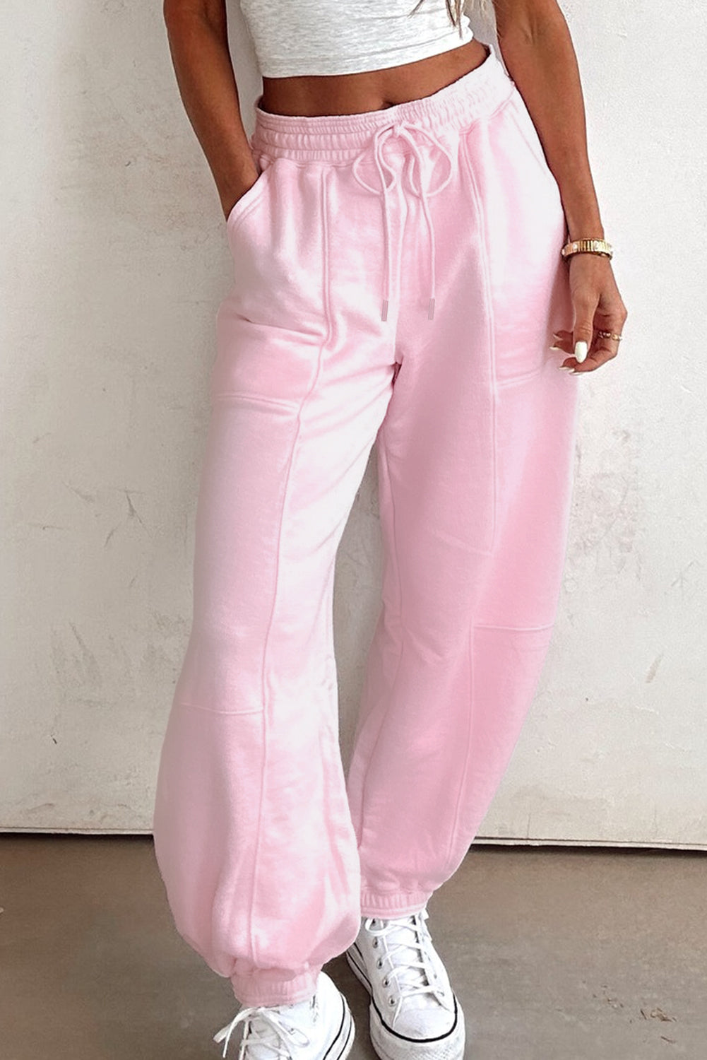 Light pink drawstring waist patchwork jogger pants by Modern Grace, casual cotton-polyester bottoms with solid color design.
