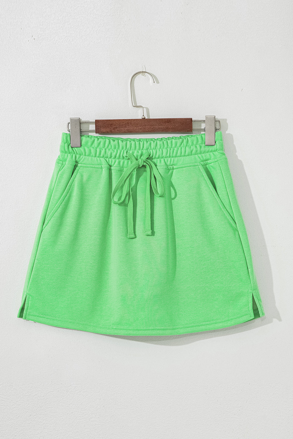Light green French terry drawstring mini skort with pockets by Modern Grace, casual bottoms with a relaxed fit and comfortable fabric.