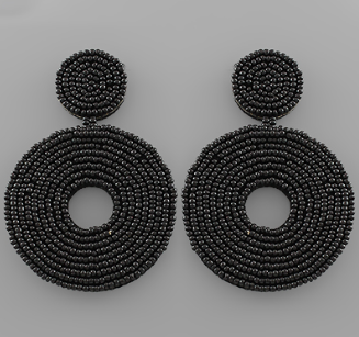 Black beaded wheel earrings by Modern Grace featuring circular design with black beads and gold accents.