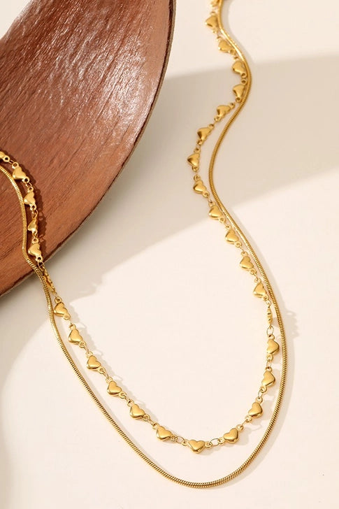 Gold stainless steel heart layered necklace by Modern Grace, featuring tarnish-free finish and multiple delicate heart pendants.