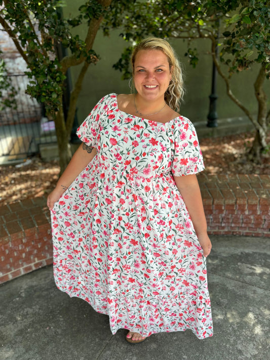 Modern Grace curvy pink floral maxi dress with flowing fabric and vibrant pattern, perfect for summer or special occasions.