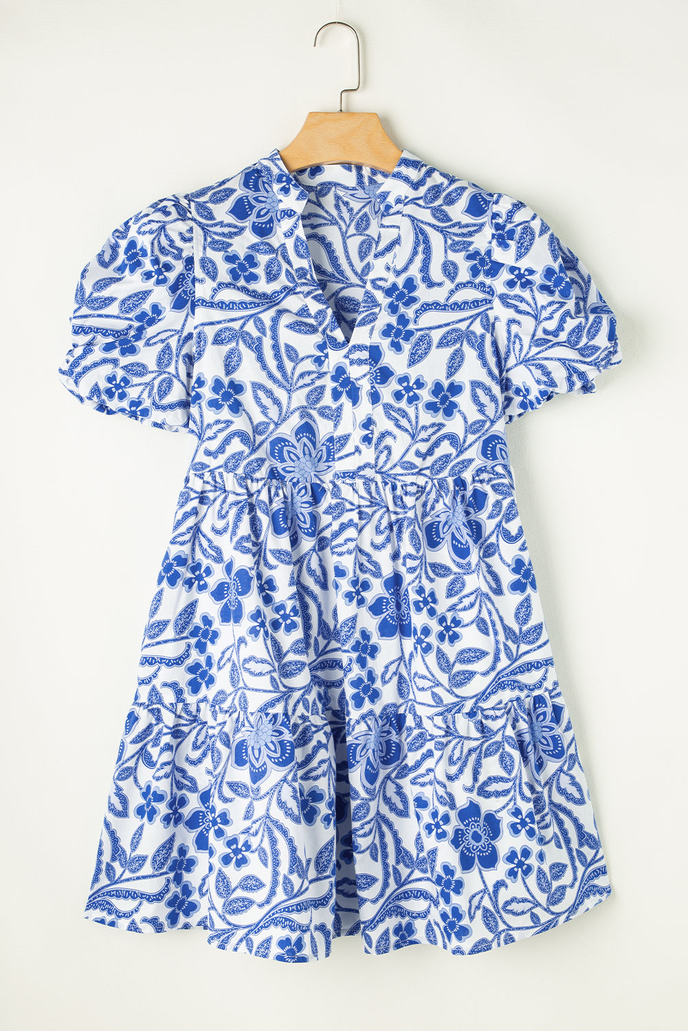 Blue flower print puff sleeve tiered dress by Modern Grace featuring a flowy silhouette and tiered design.
