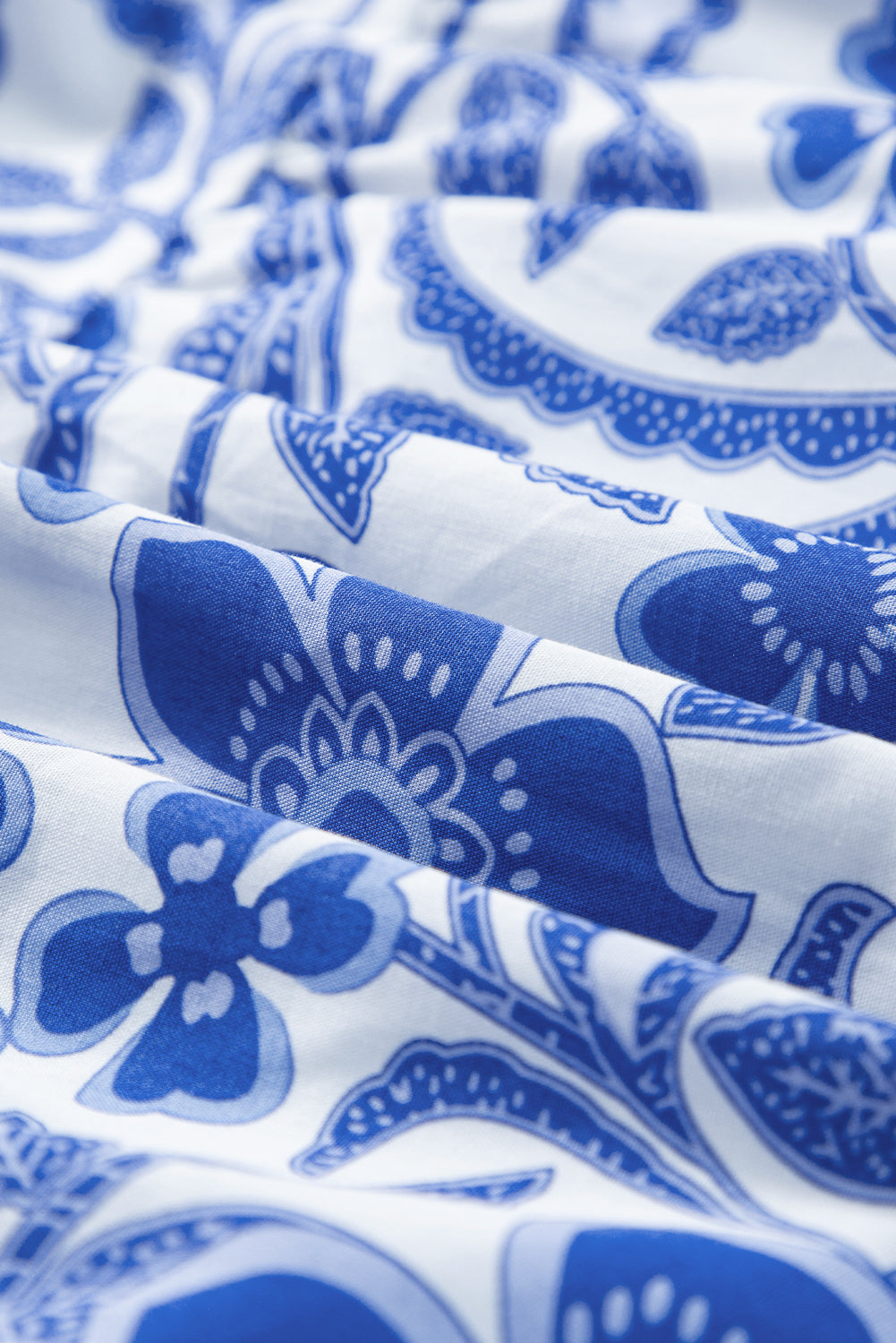 Blue flower print puff sleeve tiered dress by Modern Grace featuring a feminine design and layered skirt, perfect for spring and summer.