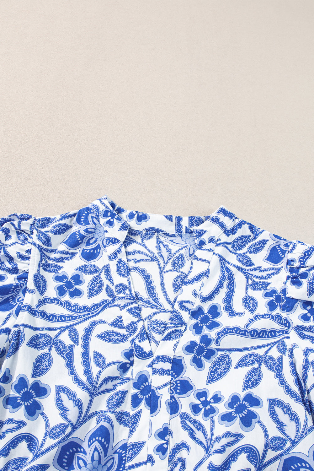 Blue flower print puff sleeve tiered dress by Modern Grace, showcasing a feminine floral design and layered fabric details.
