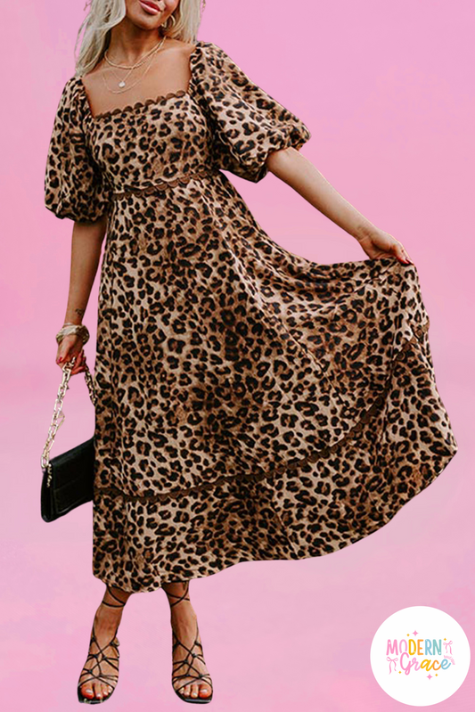 Brown leopard print maxi dress by Modern Grace with bubble sleeves and square neckline, featuring a fitted bodice and flowing skirt.