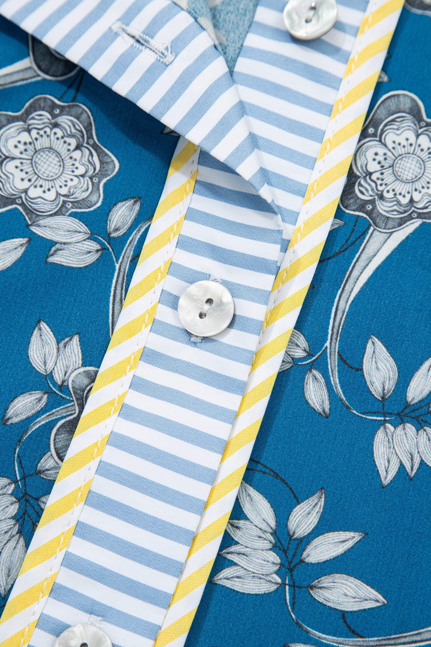 Modern Grace blue floral dress with white stripes, short sleeves, half buttons, and floral print, made of 100% cotton.