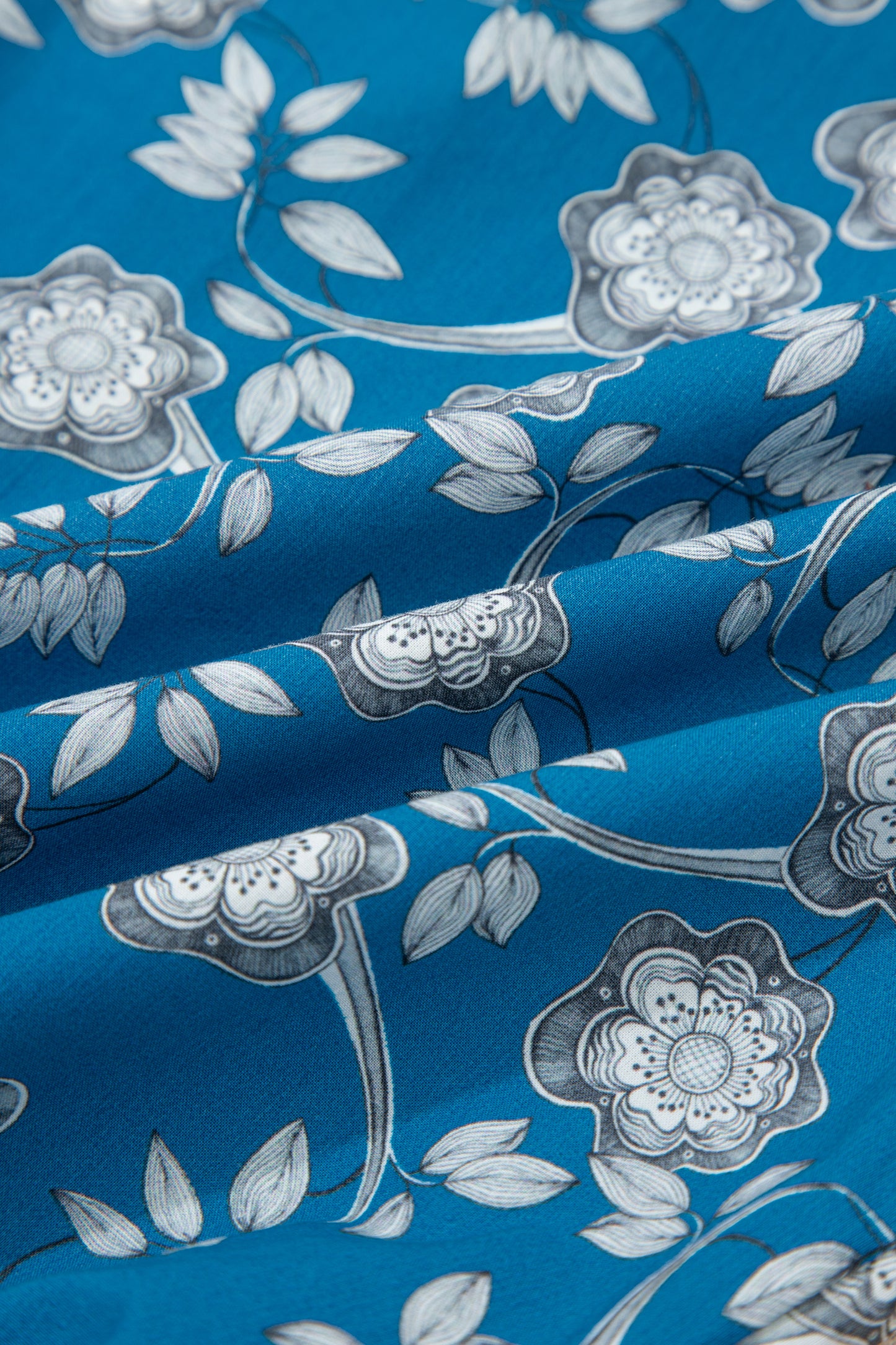 Blue striped trim floral dress by Modern Grace featuring half buttons and short sleeves, made from 100% cotton.