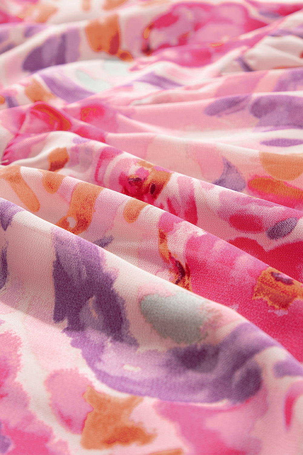 Pink abstract floral print Modern Grace maxi dress with one shoulder and shirred design, made of polyester fabric.