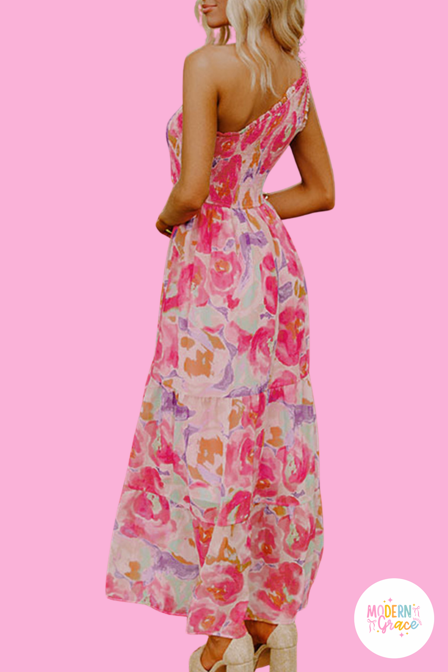 Pink floral print shirred one-shoulder maxi dress by Modern Grace, featuring abstract floral design and flowy fabric.