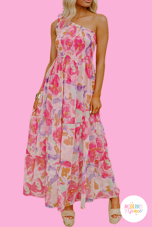Pink abstract floral print shirred one shoulder maxi dress by Modern Grace featuring a flowy silhouette and elegant design.