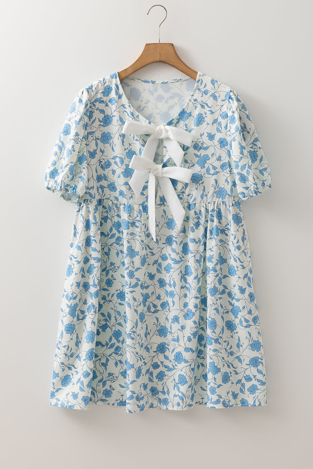 Sky blue floral contrast bow puff sleeve mini dress by Modern Grace, featuring a fitted silhouette and elegant design.