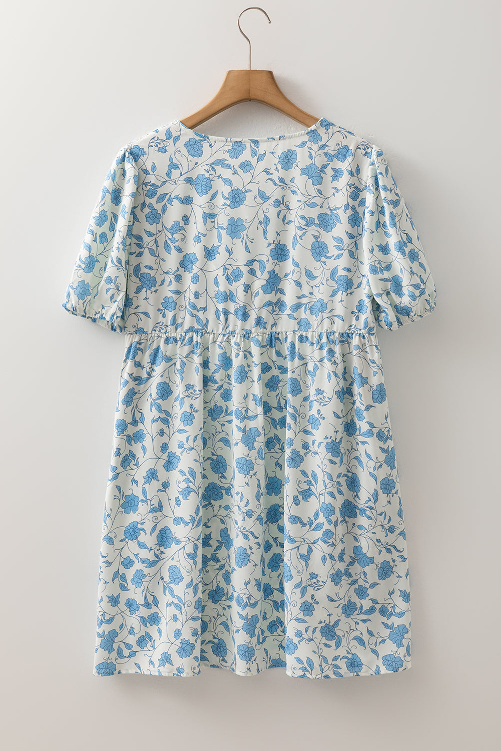 Sky blue floral contrast bow puff sleeve mini dress by Modern Grace, featuring a feminine silhouette and stylish design.